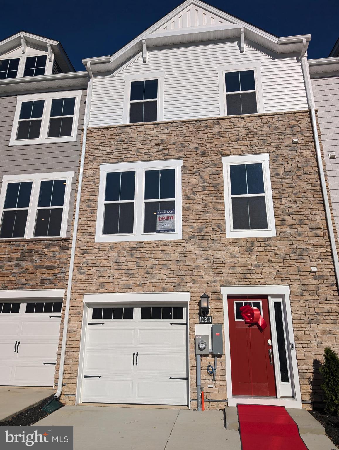 a front view of a building with large windows