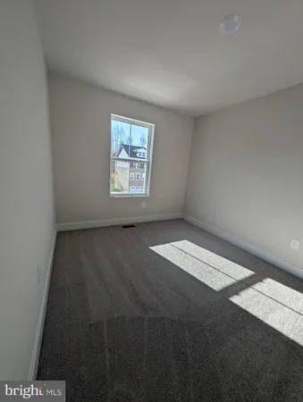 an empty room with a empty space and window