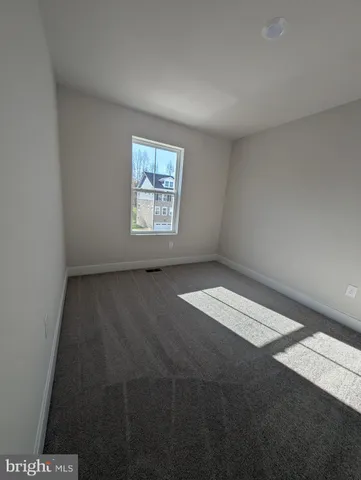 an empty room with a empty space and window