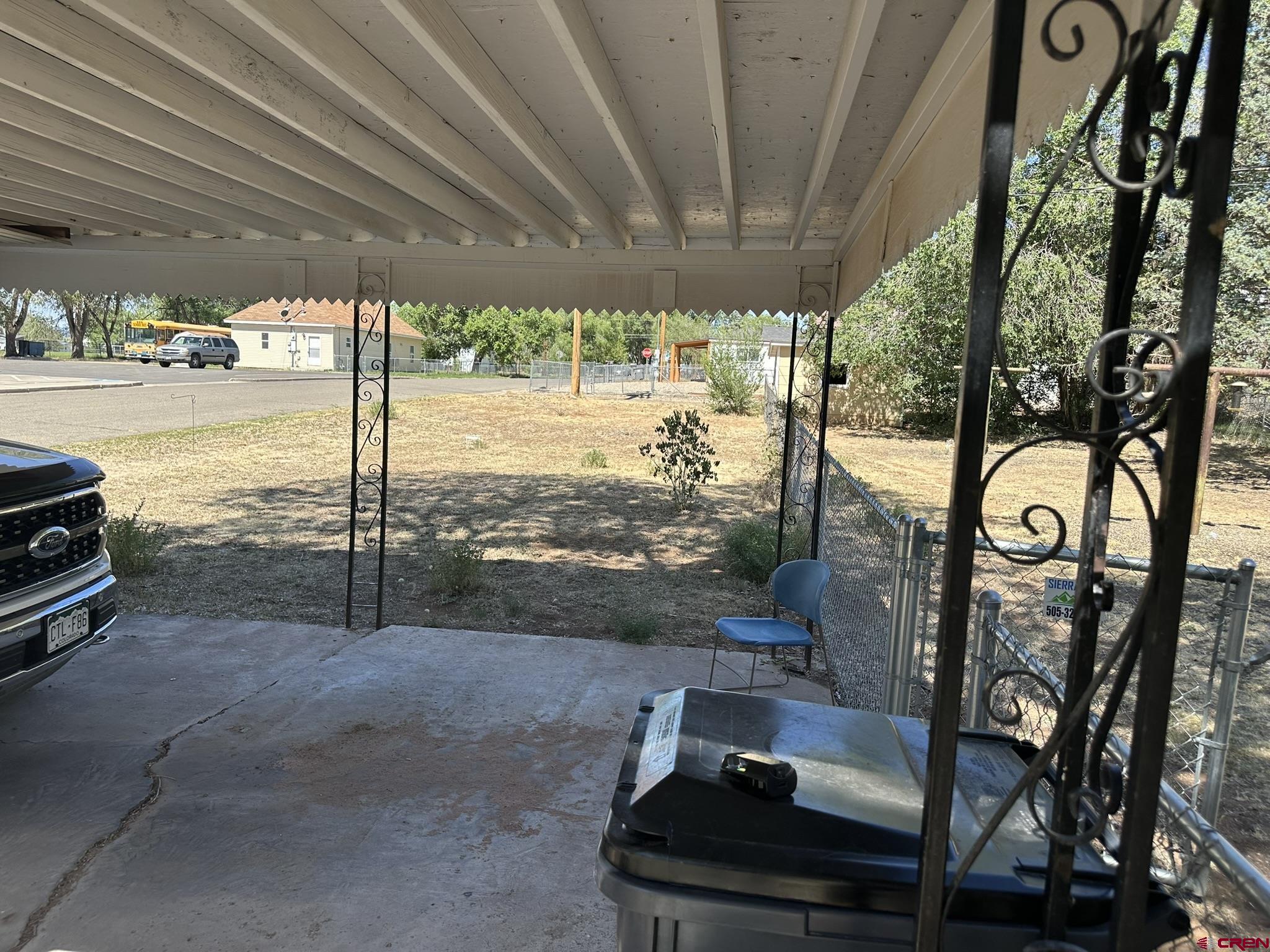 435 South Elm Street Cortez, CO 81321 - Photo 15 of 17 a view of a porch with furniture and a yard