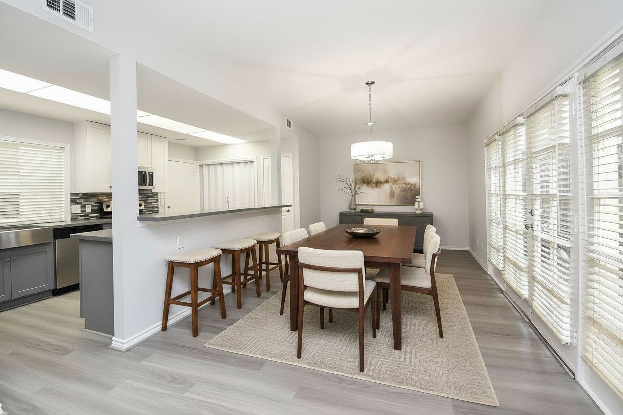 201 Vanderpool Lane, Unit 113 Houston, TX 77024 - Photo 12 of 45 a dining room with furniture a window and kitchen view