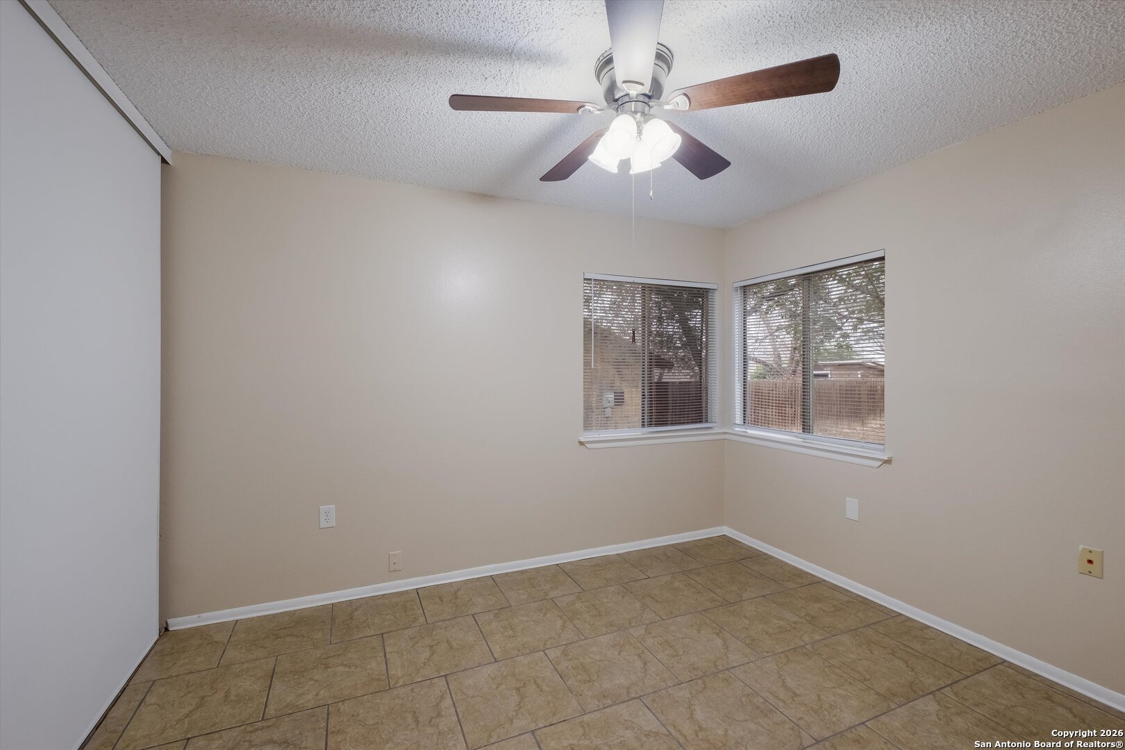 8424 8th Street Converse, TX 78109 - Photo 16 of 22 a view of an empty room with a window