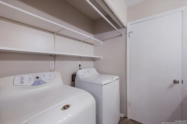 a utility room with dryer and washer