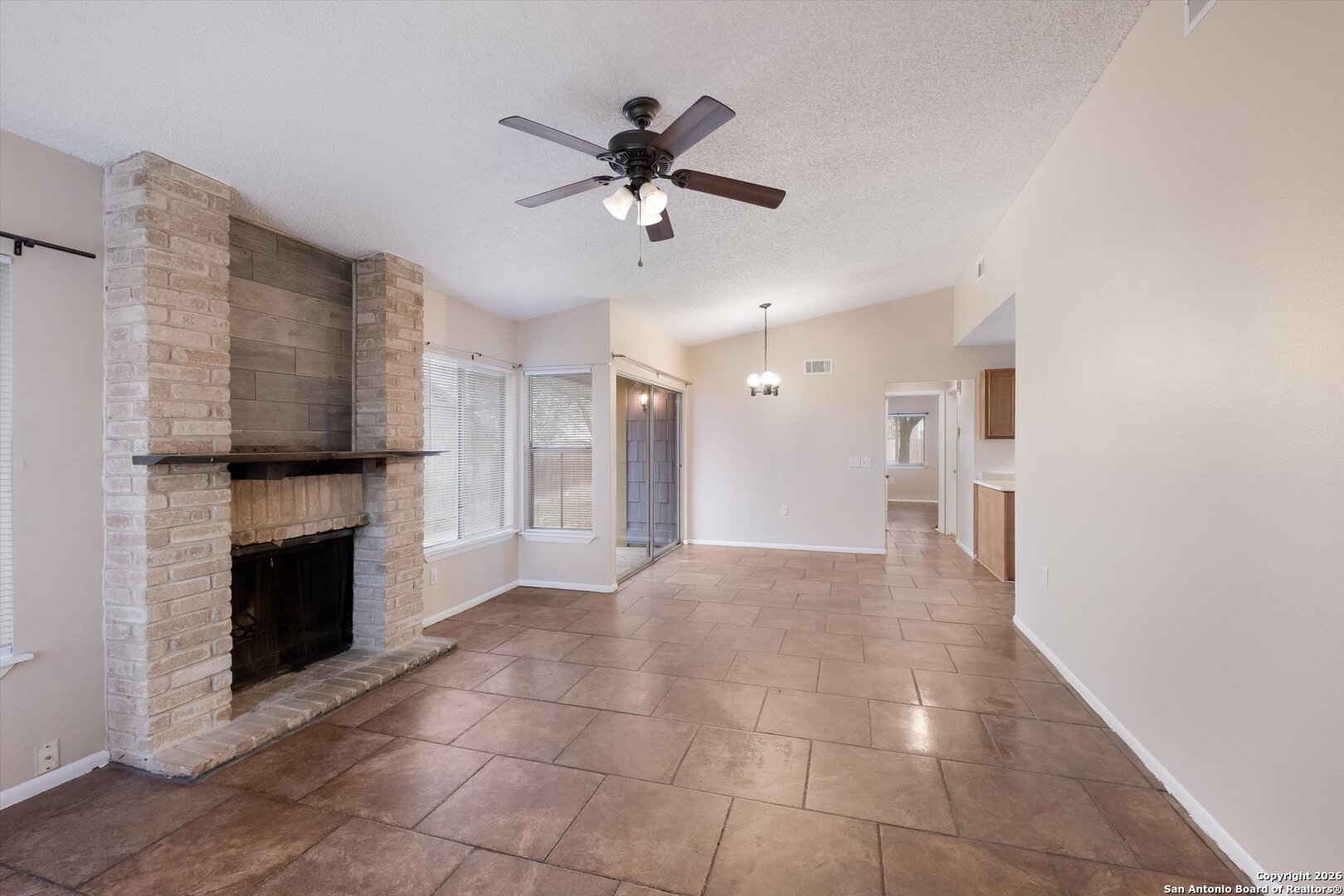 8424 8th Street Converse, TX 78109 - Photo 3 of 22 a view of a livingroom with a fireplace and window