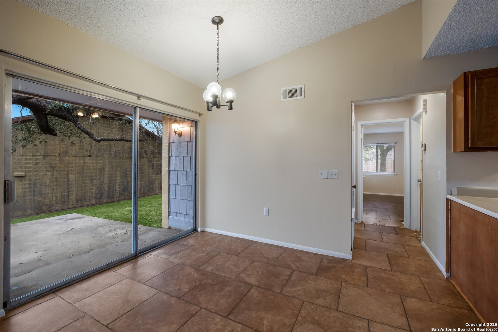 8424 8th Street Converse, TX 78109 - Photo 7 of 22 a view of a hallway with a chandelier