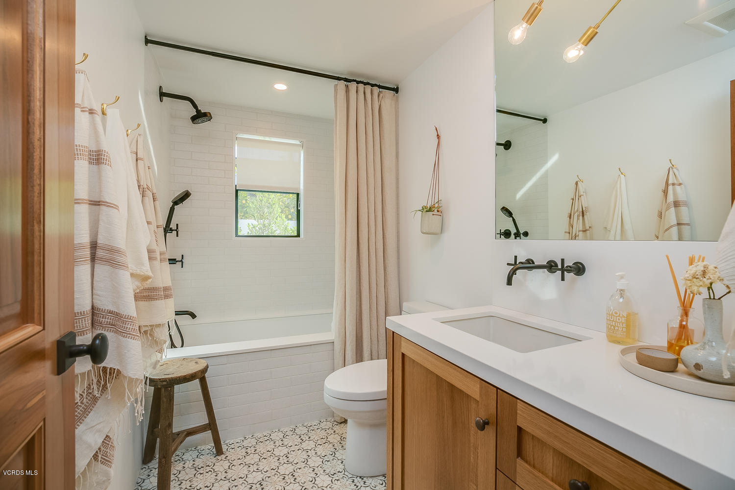 1203 Daly Road Ojai, CA 93023 - Photo 11 of 18 a bathroom with a sink a toilet and shower