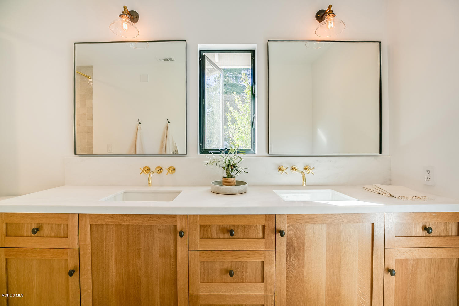 1203 Daly Road Ojai, CA 93023 - Photo 13 of 18 a bathroom with a sink and a mirror