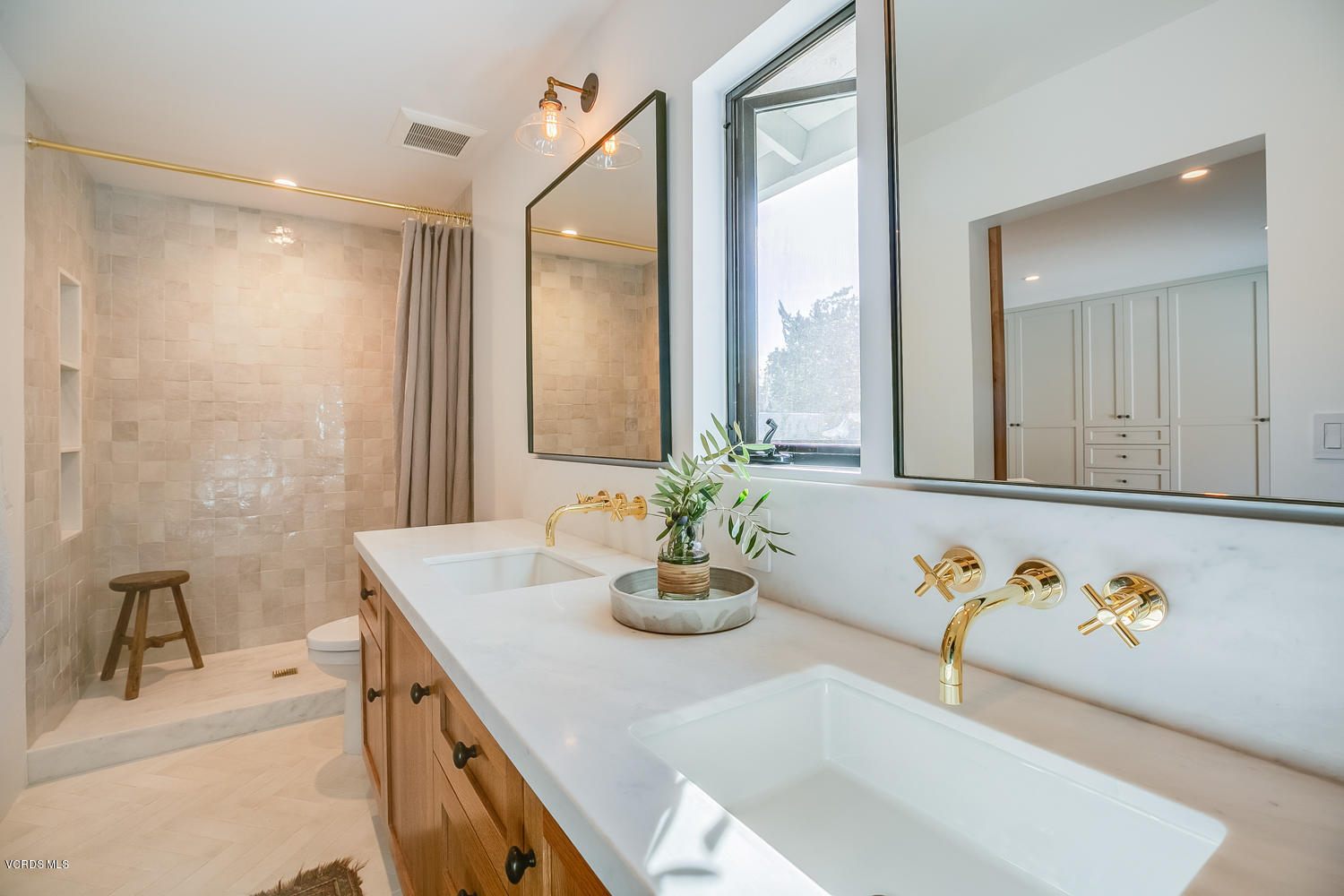 1203 Daly Road Ojai, CA 93023 - Photo 14 of 18 a bathroom with a granite countertop sink and a mirror