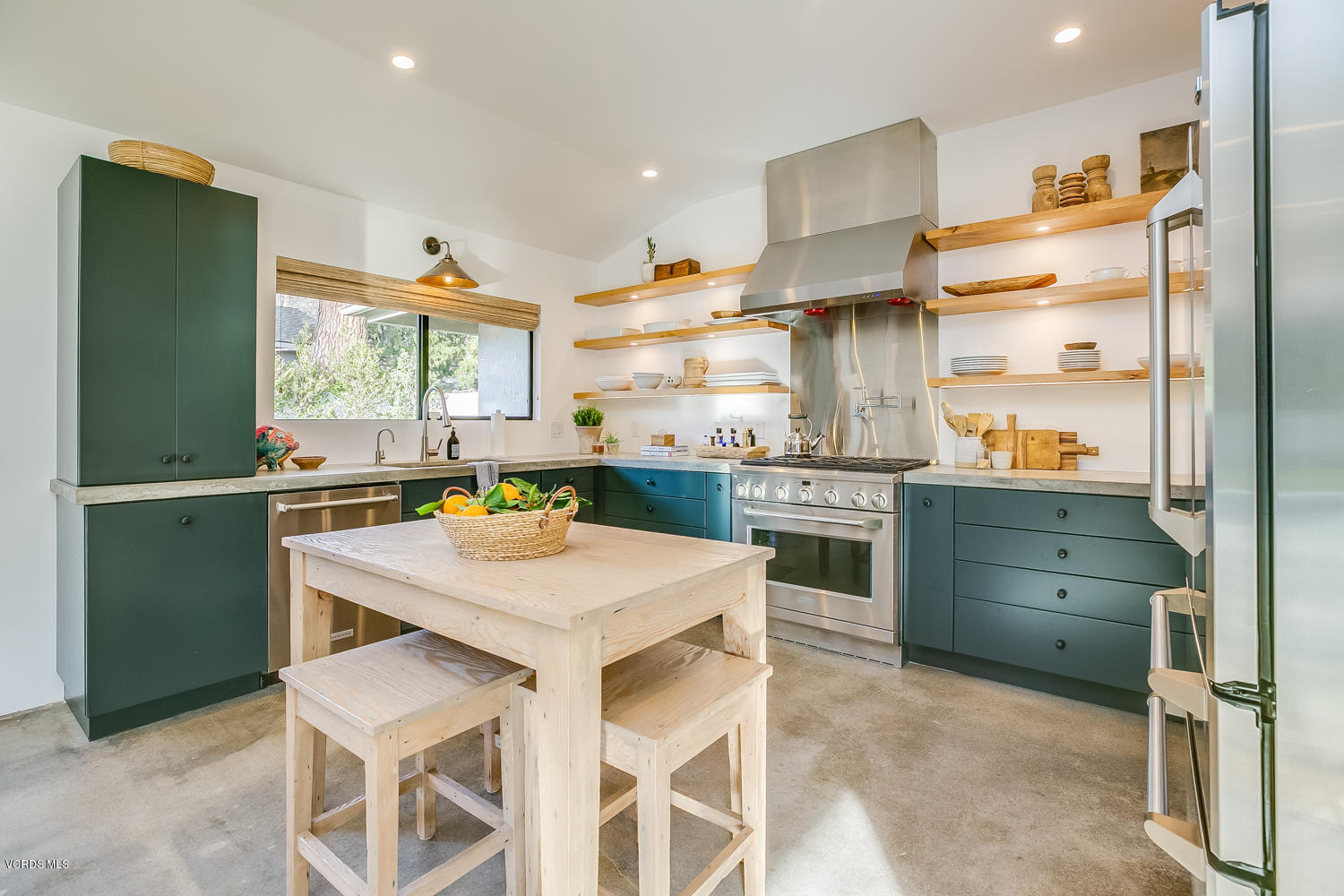 1203 Daly Road Ojai, CA 93023 - Photo 6 of 18 a kitchen with a stove a sink and a refrigerator