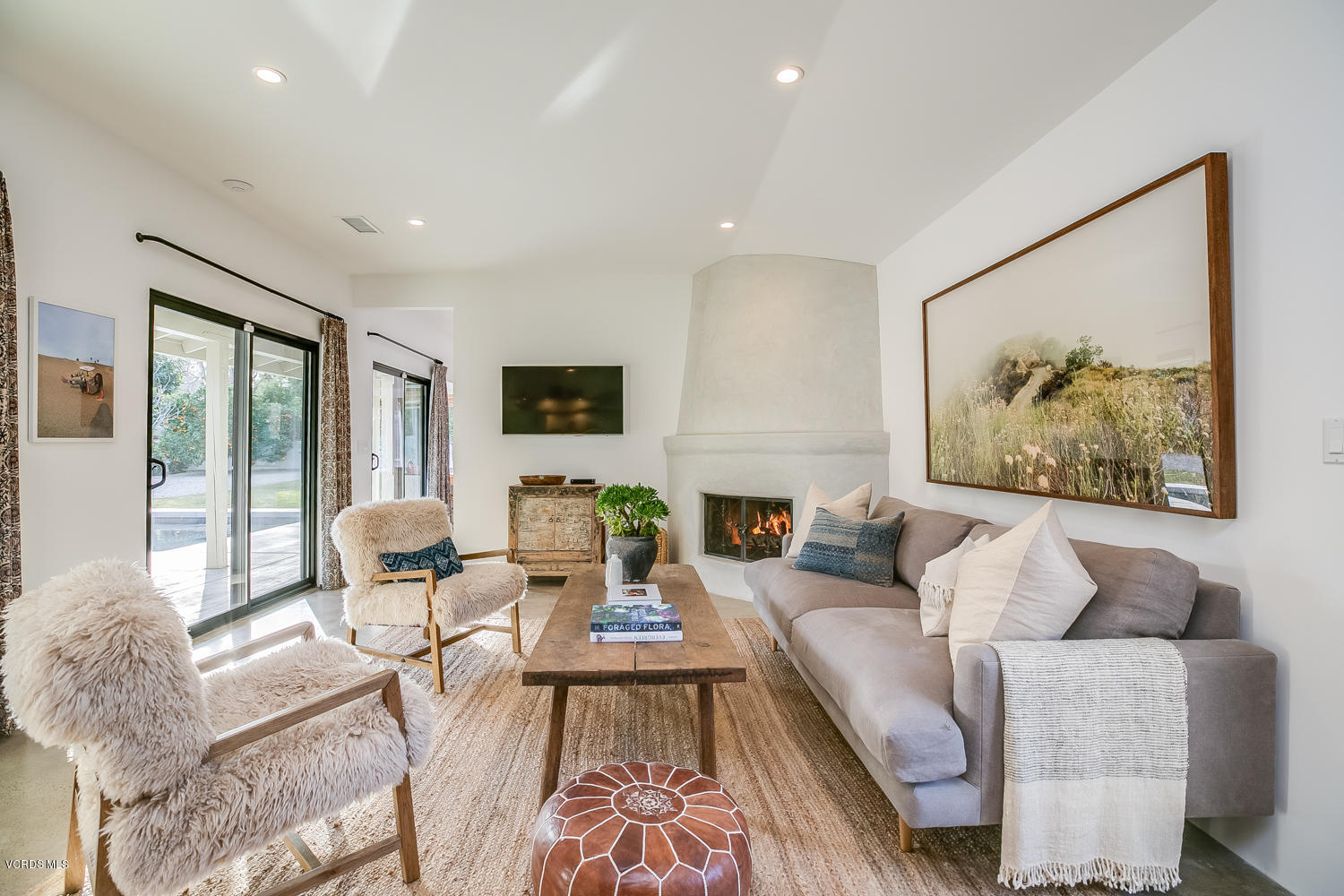 1203 Daly Road Ojai, CA 93023 - Photo 7 of 18 a living room with fireplace furniture and a large window