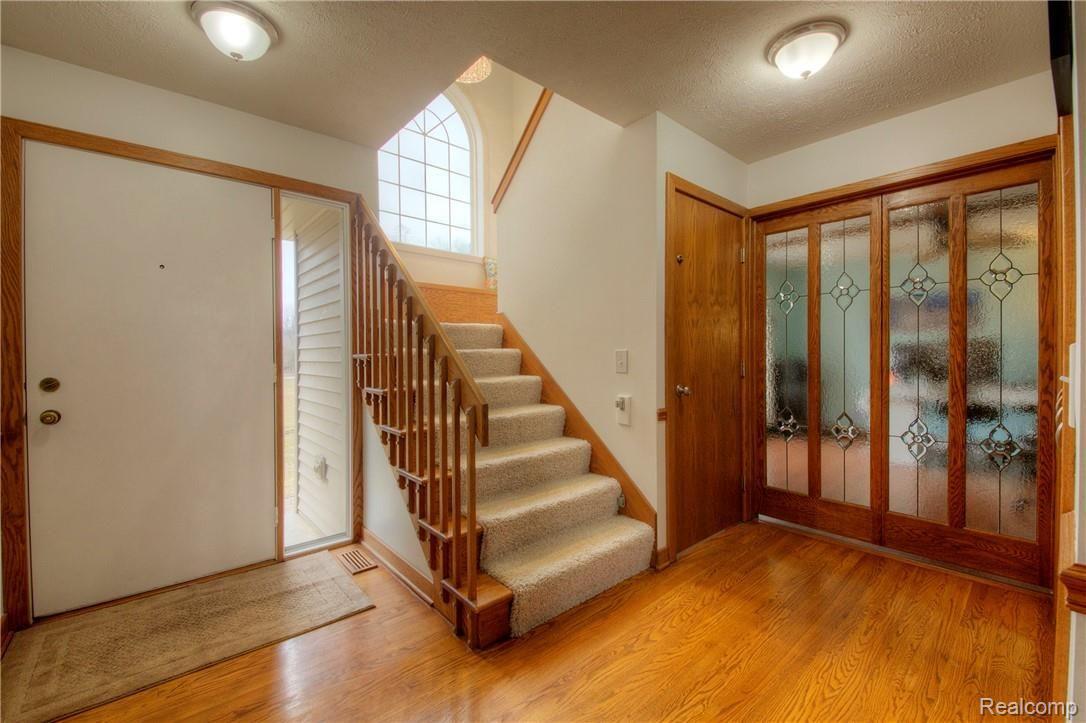 Front Entry and Stain Glass Doors to Den
