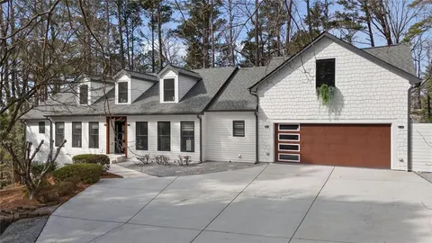 a front view of house with garage and yard