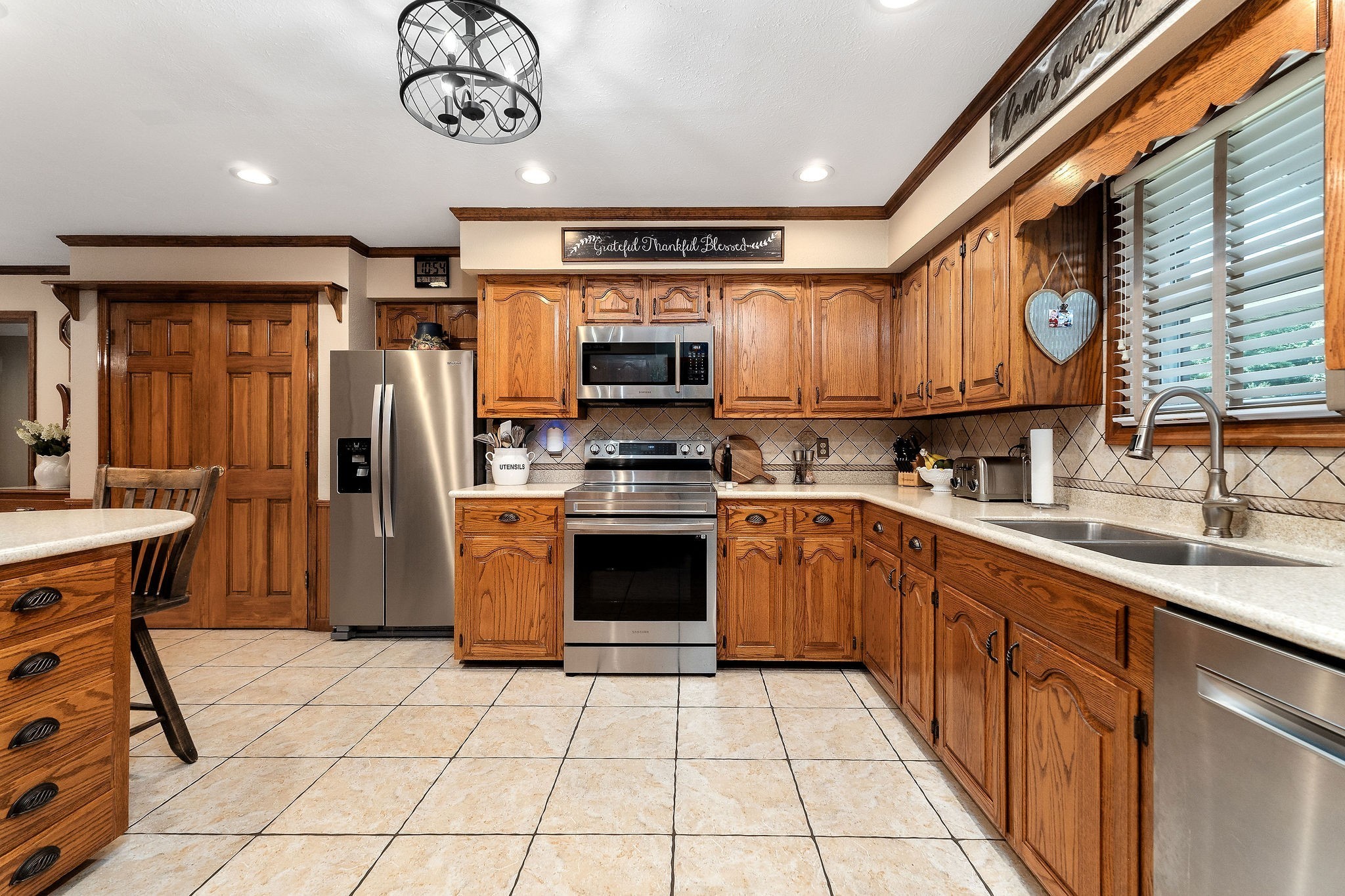 3579 Hilham Road Cookeville, TN 38506 - Photo 11 of 43 a kitchen with stainless steel appliances granite countertop a stove top oven a sink a counter top space and cabinets