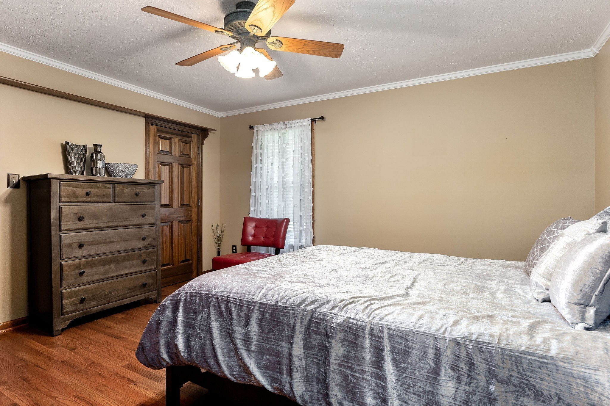 3579 Hilham Road Cookeville, TN 38506 - Photo 16 of 43 a bedroom with a bed and a chandelier