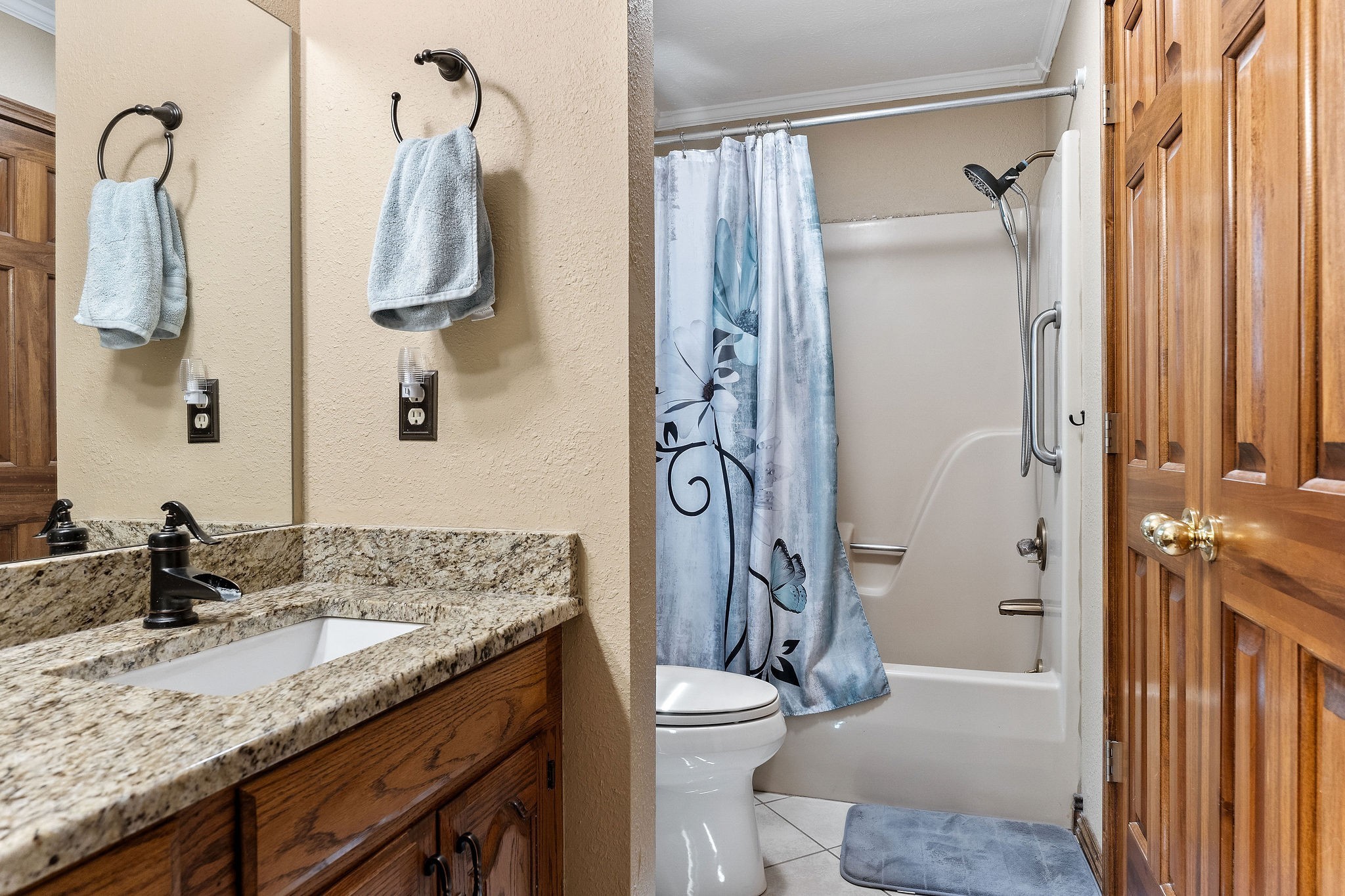 3579 Hilham Road Cookeville, TN 38506 - Photo 25 of 43 a bathroom with a granite countertop sink toilet and shower