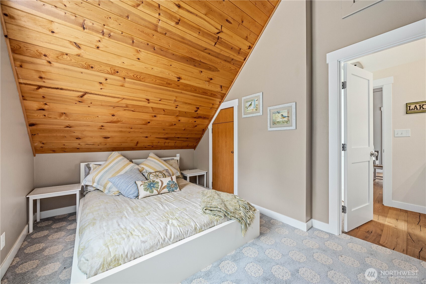 141 Sunset Place Manson, WA 98831 - Photo 26 of 38 a bed sitting in a bedroom next to a window