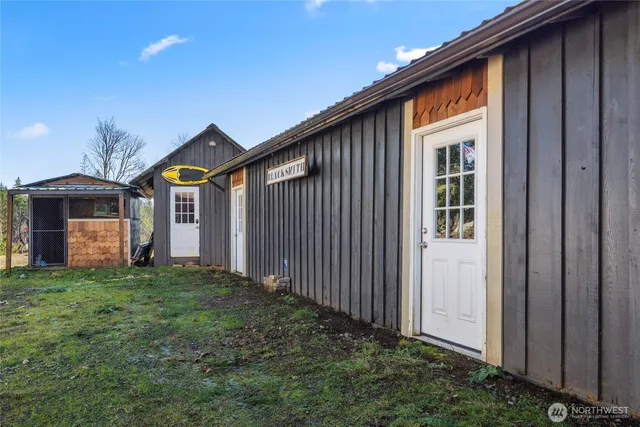 a view of a house with pool and sitting area