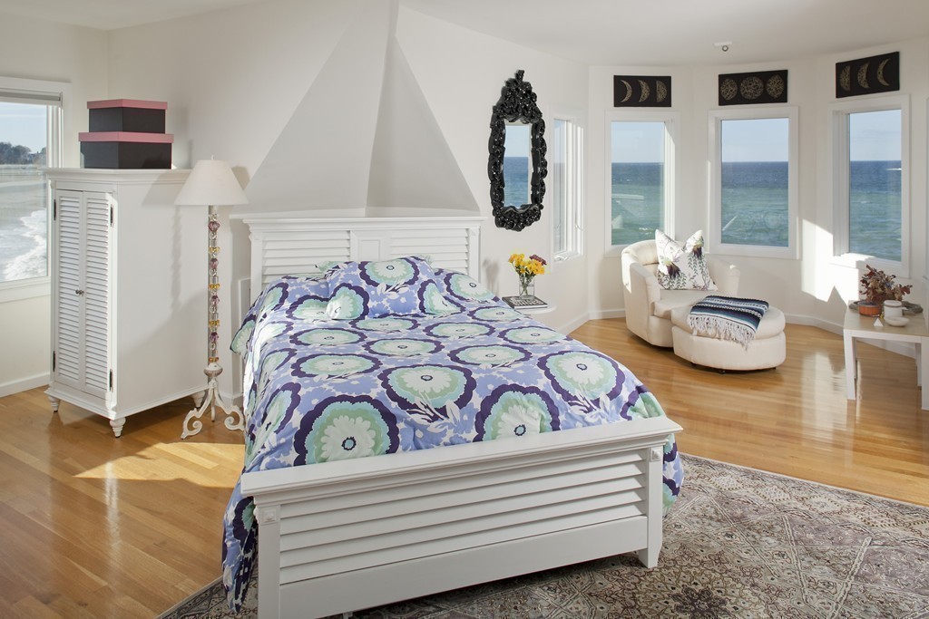 73 Seaside Road Scituate, MA 02066 - Photo 12 of 27 a bedroom with furniture and a floor to ceiling window