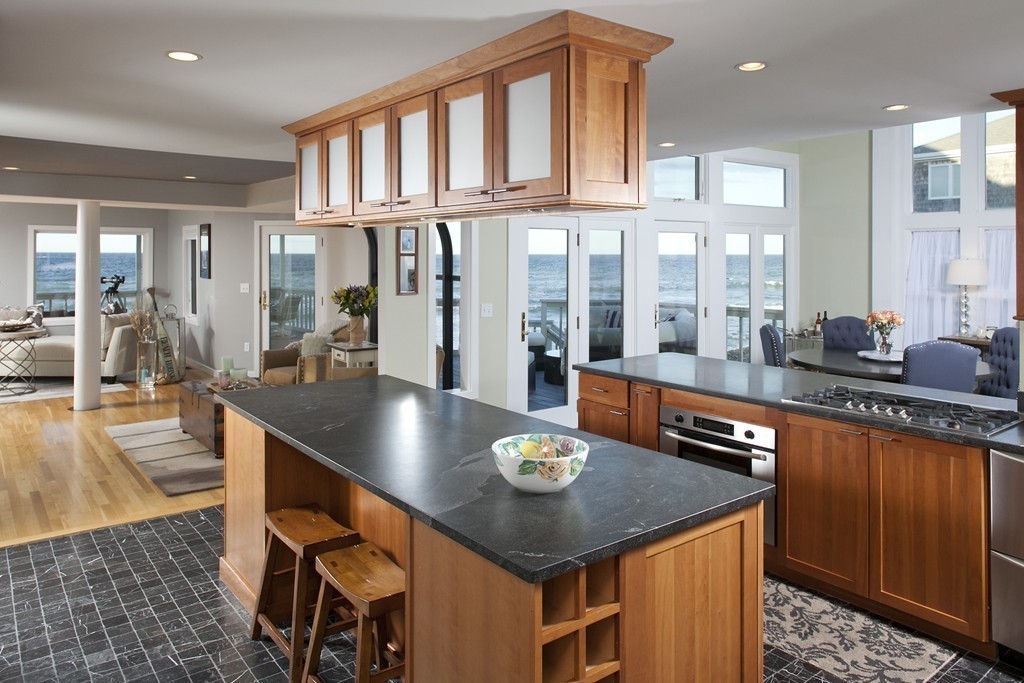 73 Seaside Road Scituate, MA 02066 - Photo 2 of 27 a kitchen with stainless steel appliances granite countertop a sink a stove and chairs