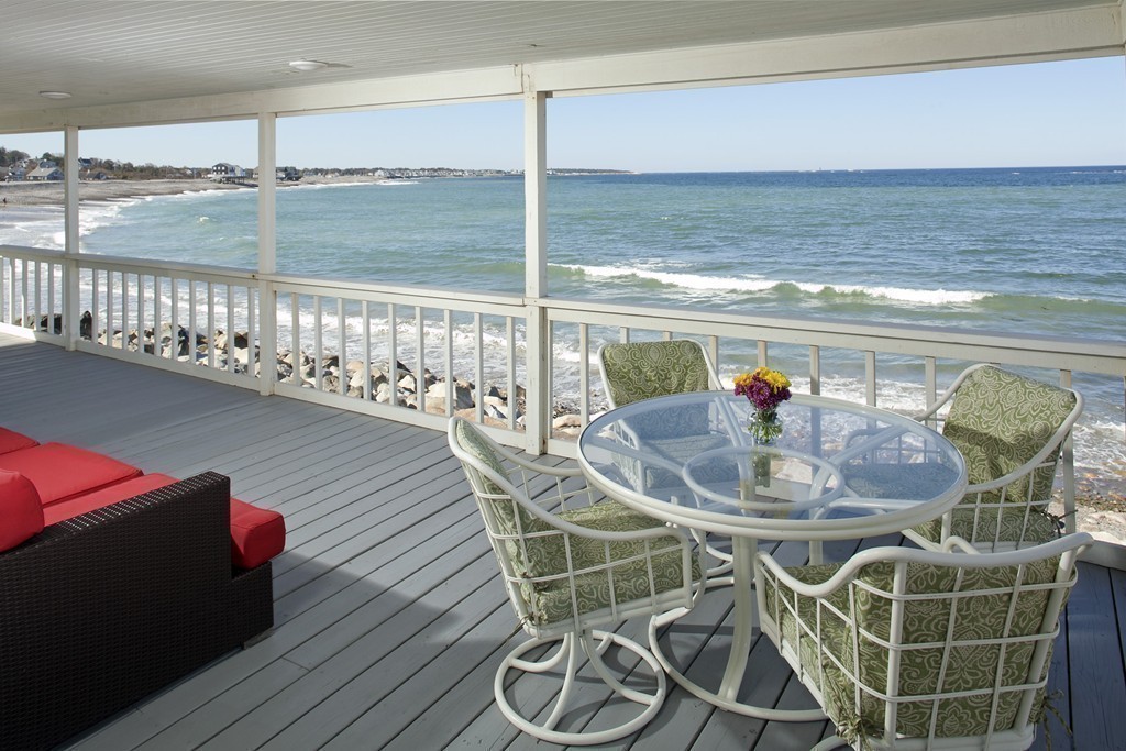 73 Seaside Road Scituate, MA 02066 - Photo 22 of 27 a dining room with furniture and a floor to ceiling window
