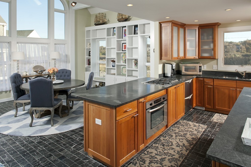 73 Seaside Road Scituate, MA 02066 - Photo 5 of 27 a kitchen with stainless steel appliances granite countertop a stove a sink and a refrigerator