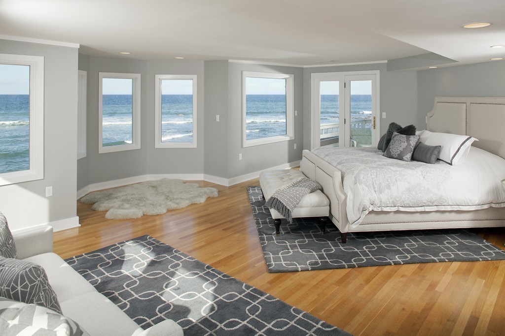 73 Seaside Road Scituate, MA 02066 - Photo 9 of 27 a bedroom with a bed and wooden floor