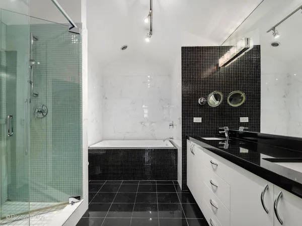 a bathroom with a bathtub and a shower
