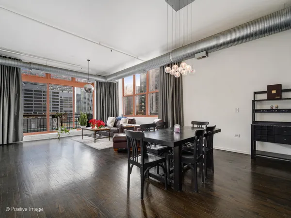 a view of a livingroom with furniture window and wooden floor