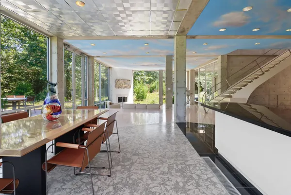 a view of a dining room with furniture window and outside view