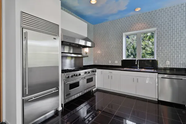 a bedroom with furniture and a fireplace