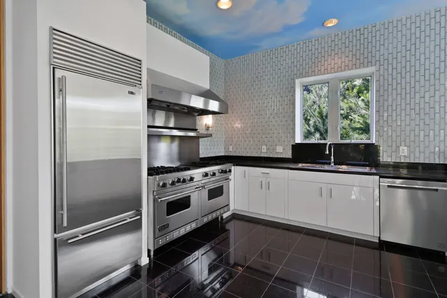 a bedroom with furniture and a fireplace