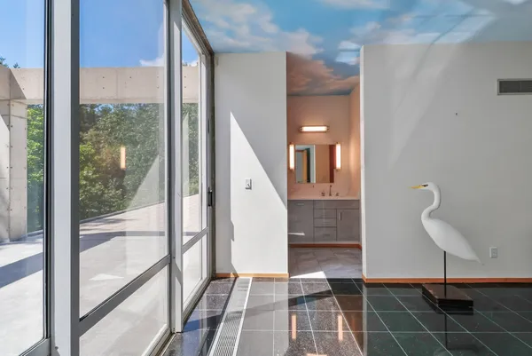 a view of a lush green forest with lots of trees