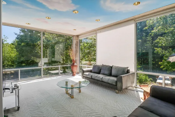 a view of a patio with table and chairs