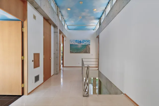 an aerial view of residential houses with outdoor and green space