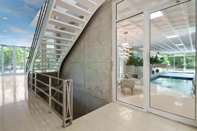 a lobby with furniture and a potted plant