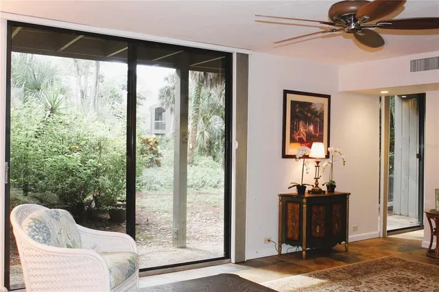 a view of a livingroom with furniture and a window