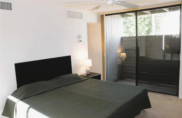 a bedroom with a bed window and bathroom
