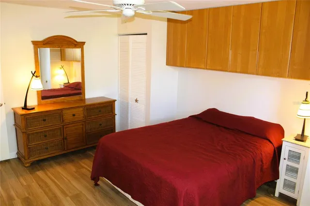 a bedroom with a bed and a dresser