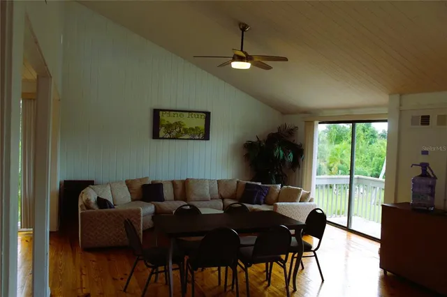 a dining room with furniture and window