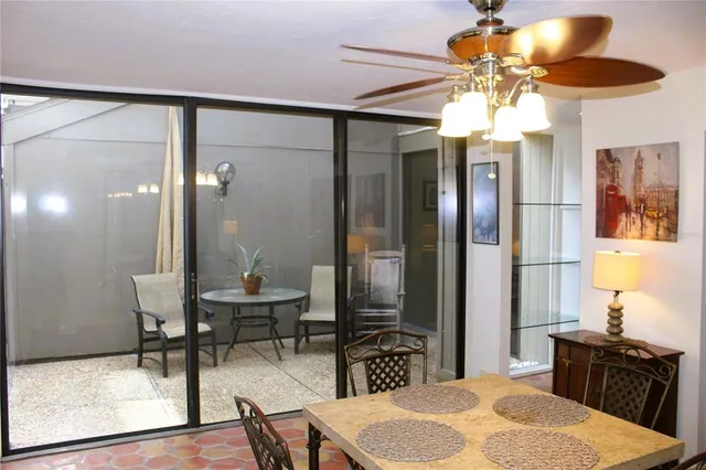 a dining room with furniture and window