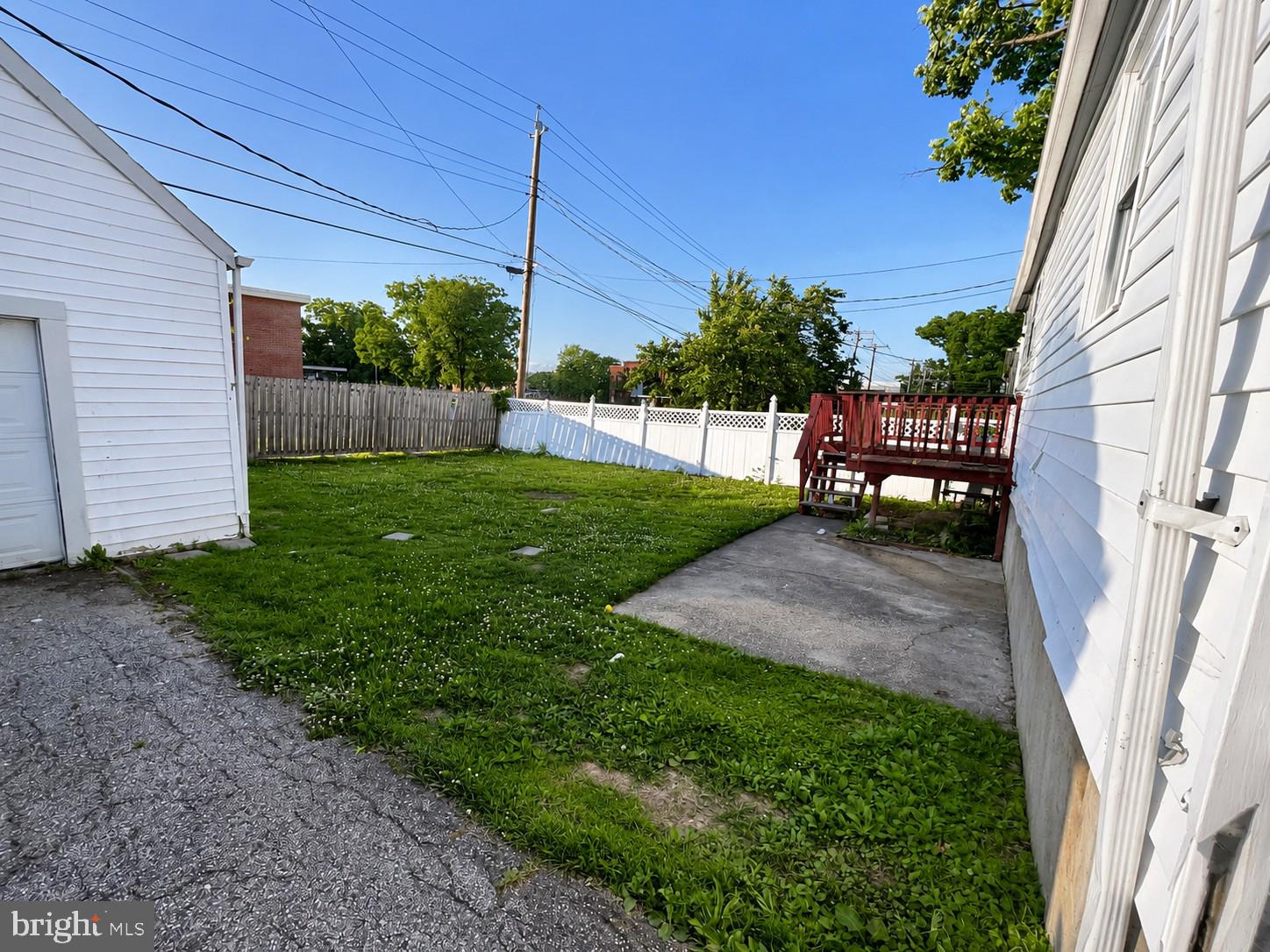 1732 Langley Road Essex, MD 21221 - Photo 8 of 9 Spacious backyard with serene greenery.