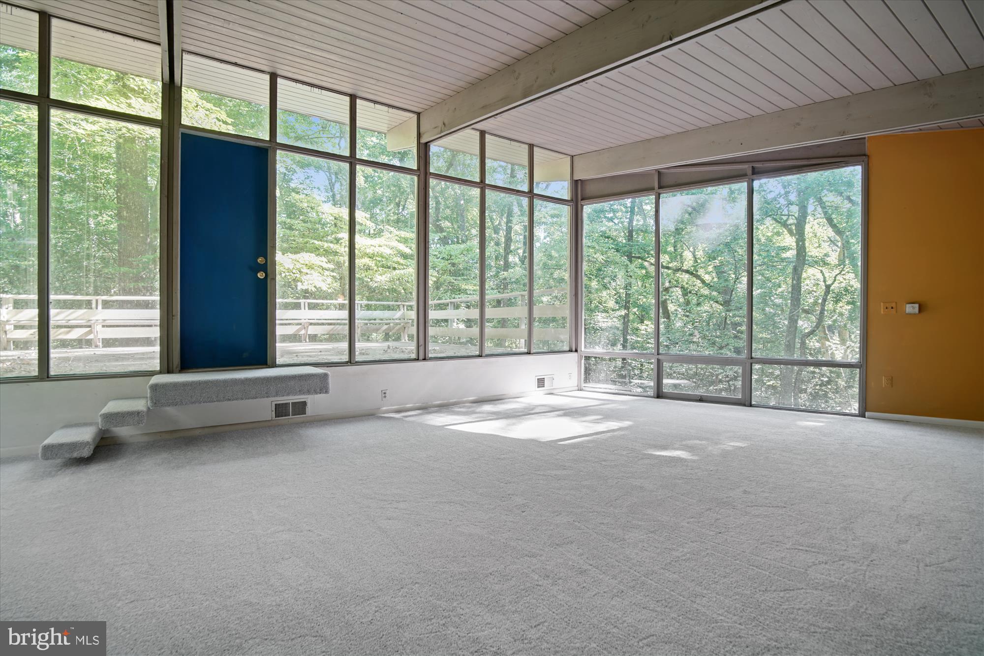 14711 Reserve Road Accokeek, MD 20607 - Photo 10 of 63 Walls of windows and floating stairs lead to deck