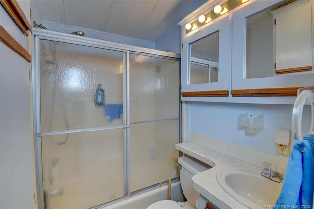 a bathroom with a sink and mirror