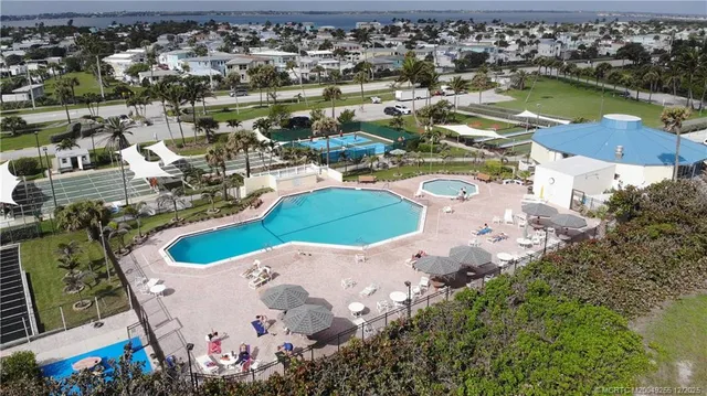 an aerial view of a house with a lake view