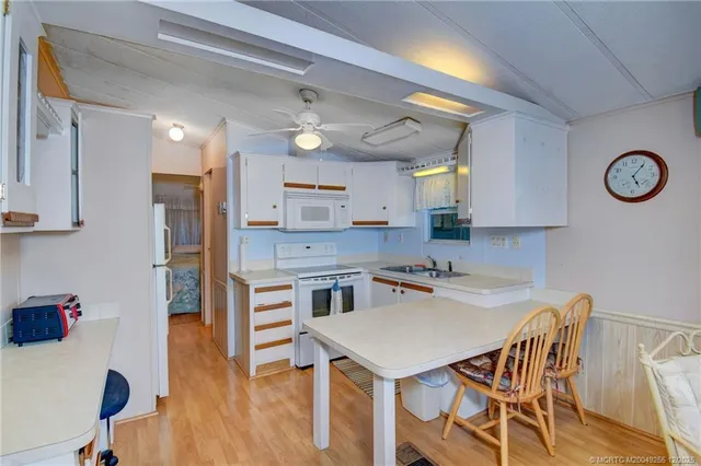a kitchen with a table and chairs in it