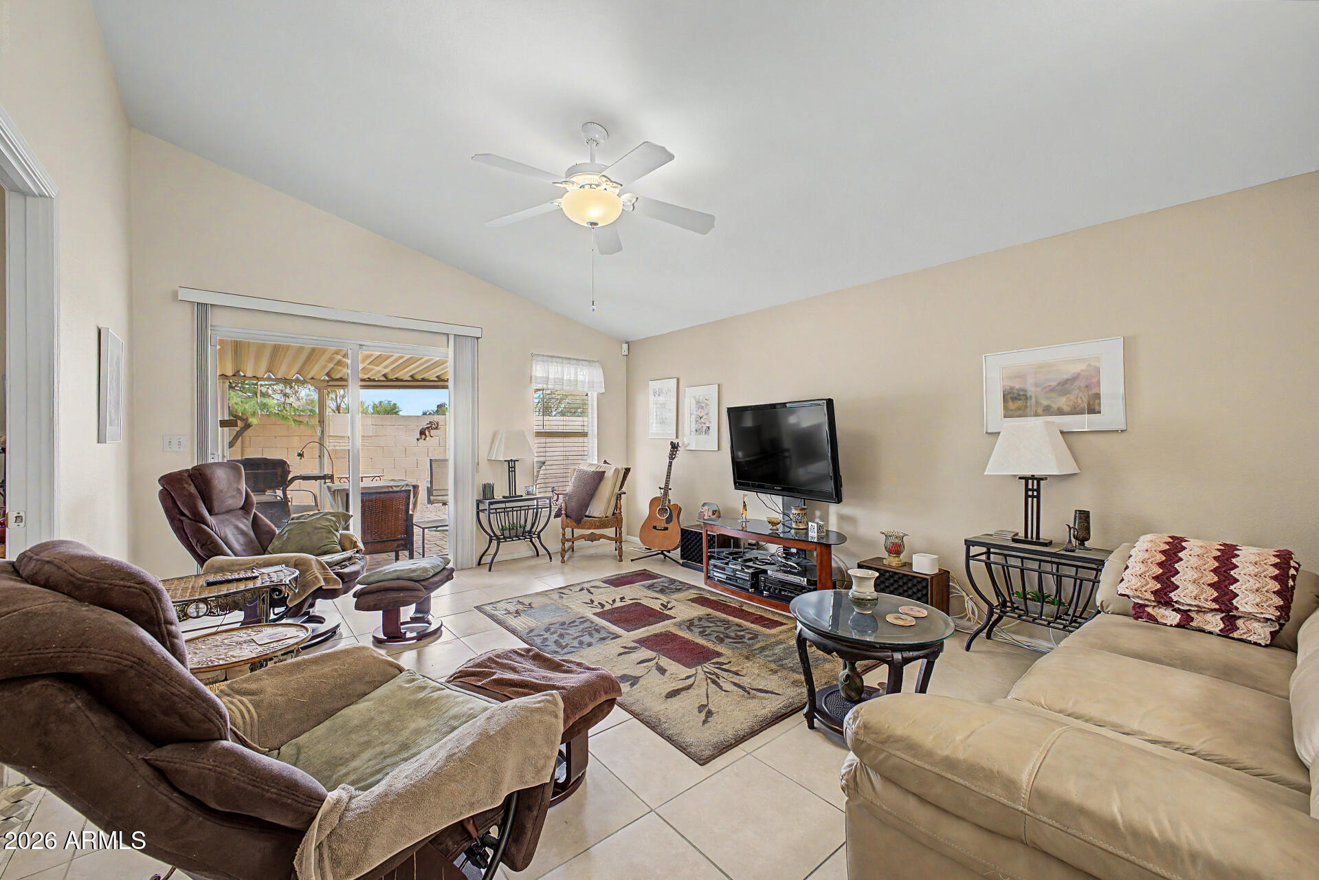2101 South Meridian Road, Unit 45 Apache Junction, AZ 85120 - Photo 4 of 36 a living room with furniture and a flat screen tv