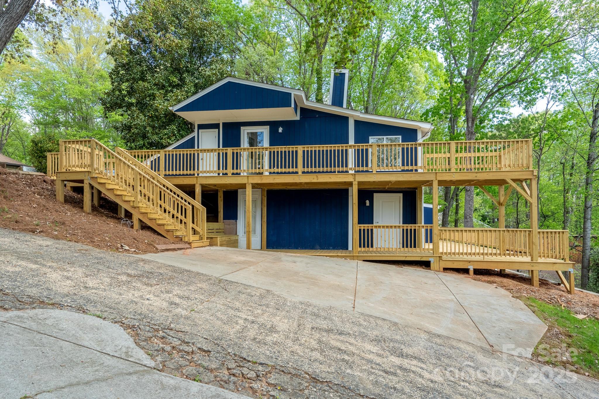 2066 Marquesas Avenue Fort Mill, SC 29708 - Photo 1 of 45 a front view of a house with a yard and balcony