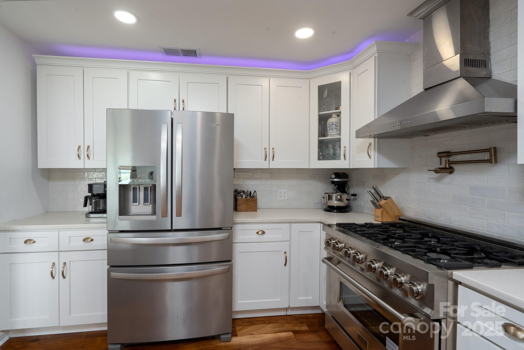 2066 Marquesas Avenue Fort Mill, SC 29708 - Photo 15 of 45 a kitchen with stainless steel appliances a refrigerator sink and cabinets