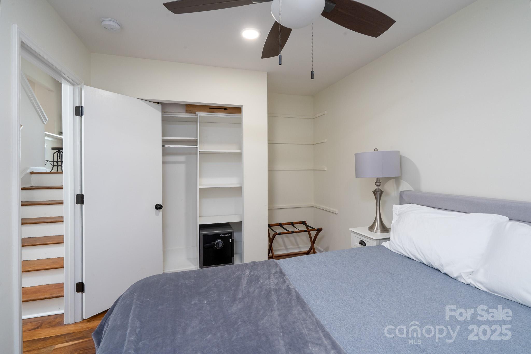 2066 Marquesas Avenue Fort Mill, SC 29708 - Photo 21 of 45 a bedroom with a bed and a chandelier