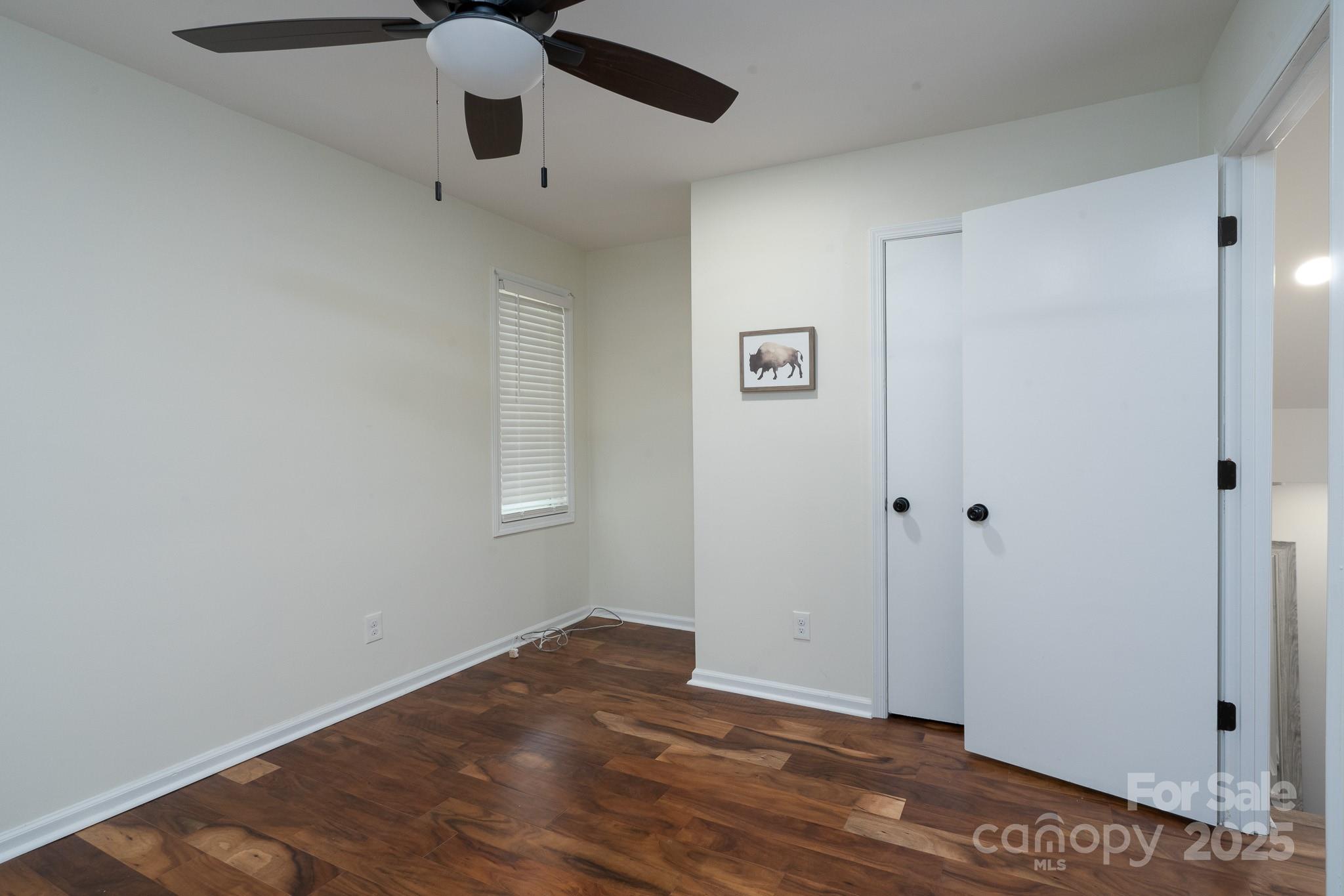 2066 Marquesas Avenue Fort Mill, SC 29708 - Photo 23 of 45 a view of an empty room with wooden floor